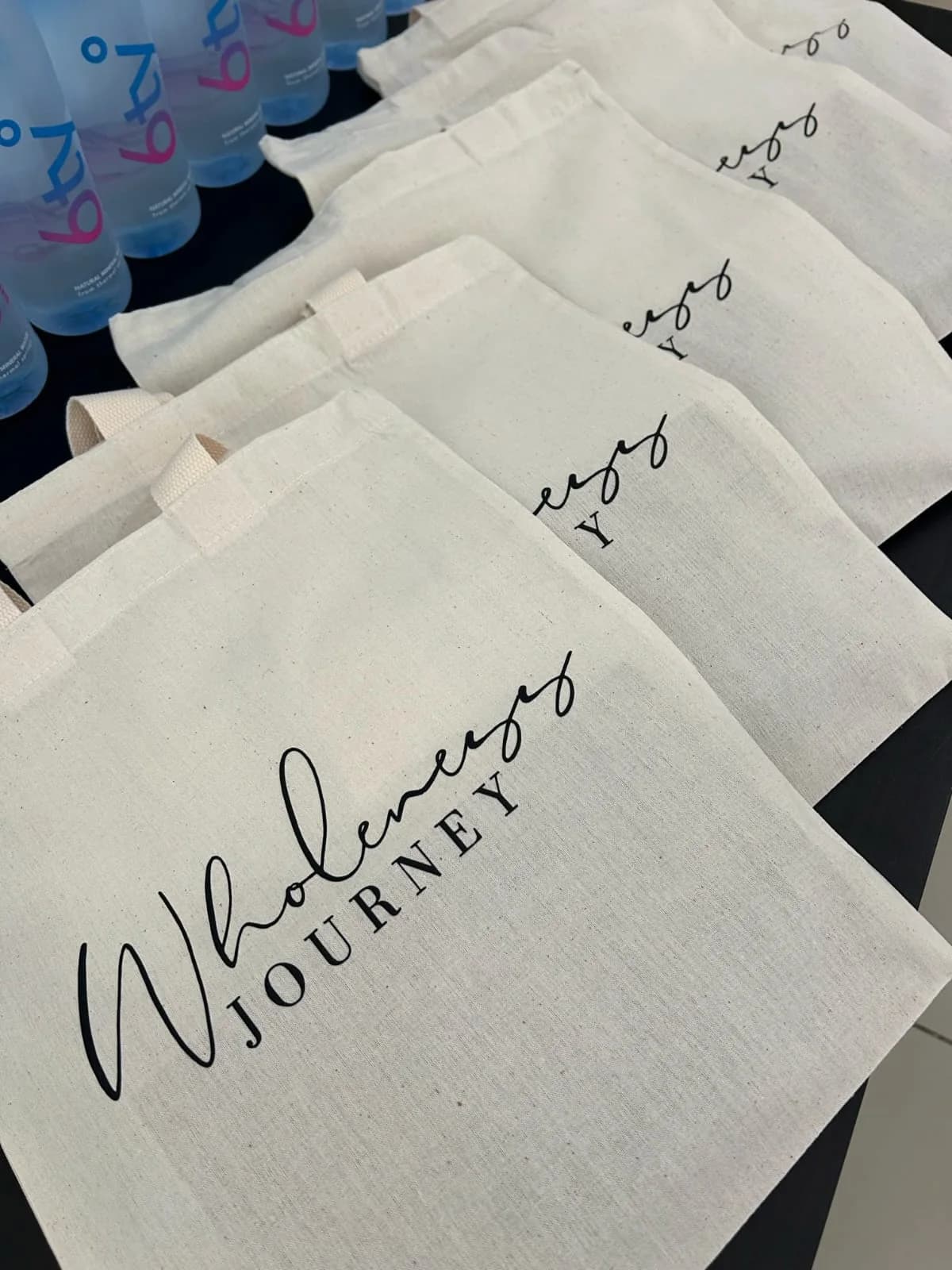 Canvas Wholeness Journey tote bags laid out and ready for a retreat.